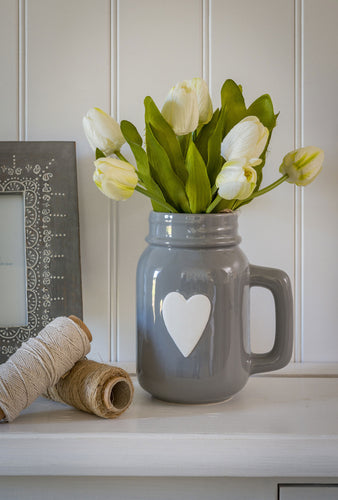 Grey ceramic jug with white heart